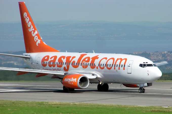 Police board easyJet flight at Birmingham Airport, delivering urgent message to passengers