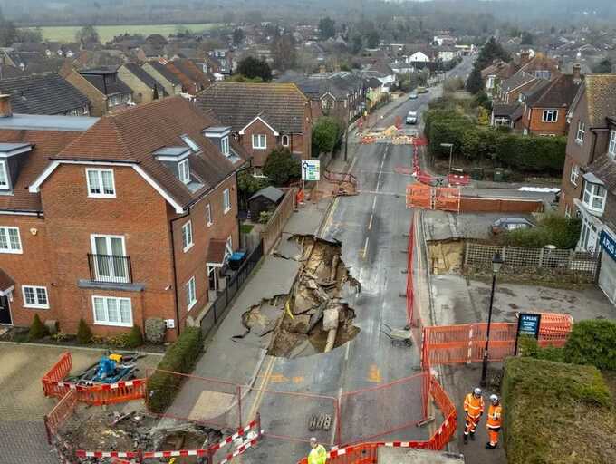 Massive 65ft sinkhole that damaged the street might take a whole year to repair, residents were informed