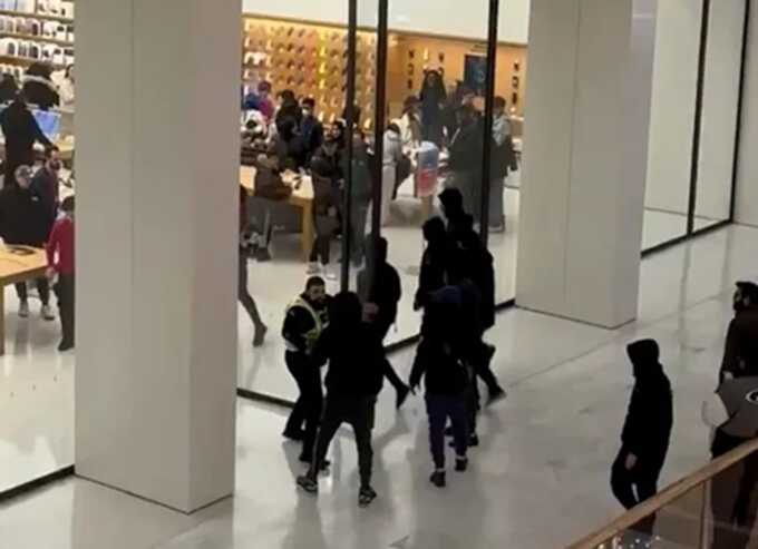 One guard backed off after being confronted with a ‘shank’ when the five masked robbers burst into the Apple store (Picture: X/@ChrisAnagnosti)