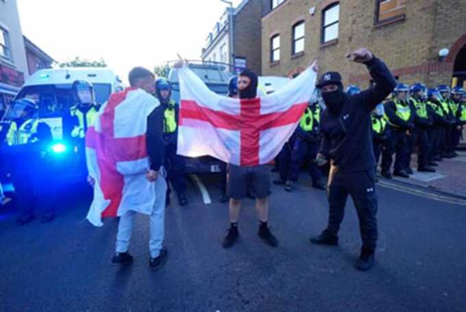 Rocks, rage and riot: anti-migrant protest turns violent outside Epping Forest hotel