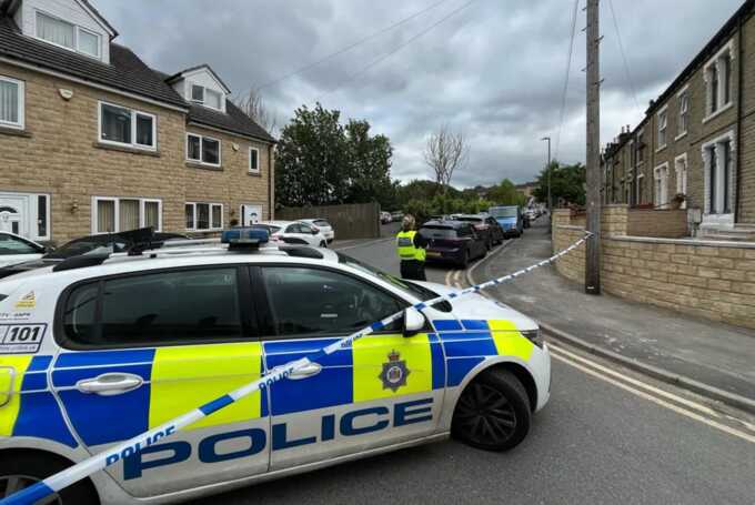Cops rushed to Bulay Road in Huddersfield after three men were injured in the reported shootingCredit: Andrew Robinson/YorkshireLive