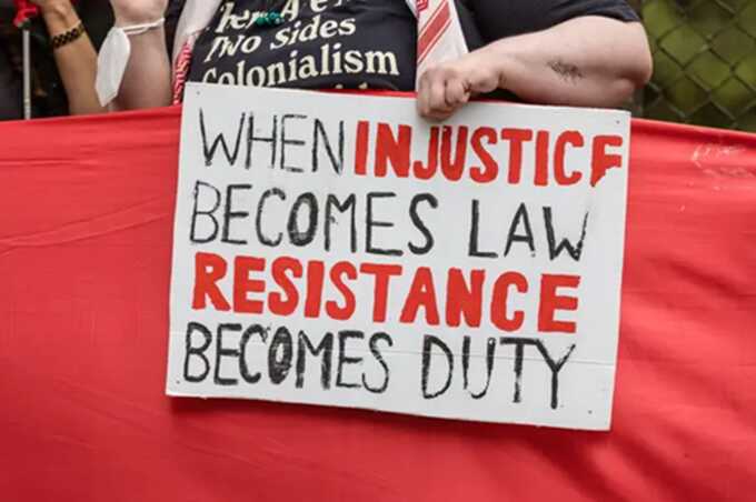 Palestine Solidarity Campaign activists surround the entrance to RAF High Wycombe with a large red cloth during a protest calling for an arms embargo on Israel. Picture: Alamy