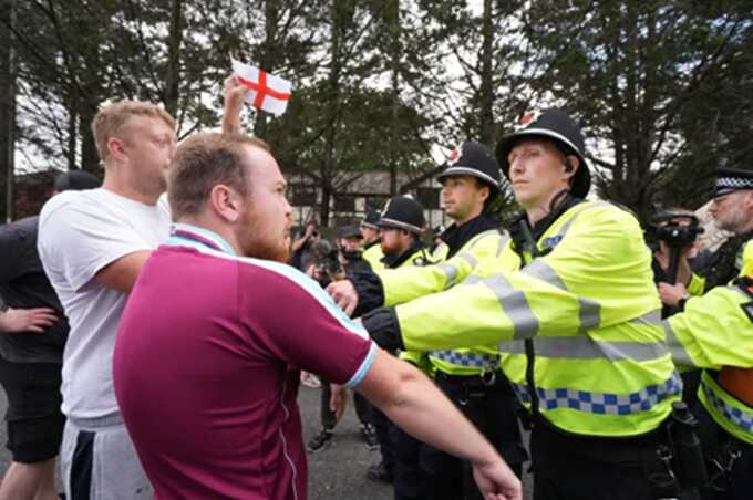 Clashes erupt at migrant hotels as 30 anti-immigration protests sweep UK
