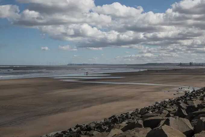 Two men die after rescuing children from sea at UK beach