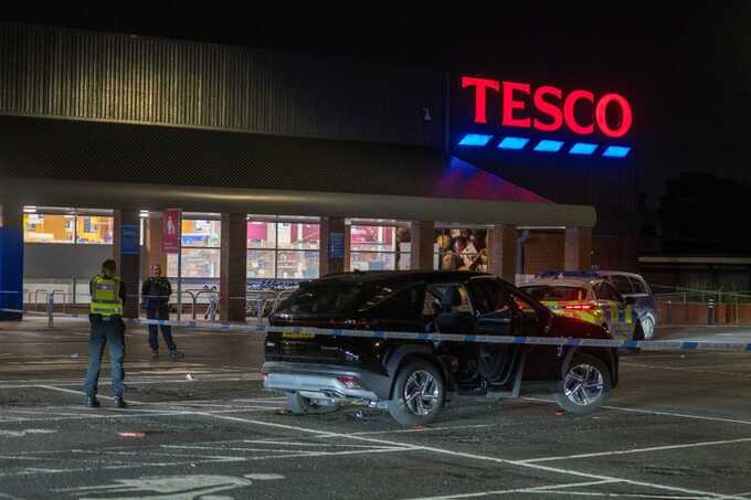 Two men stabbed and woman assaulted in violent Tesco car park attack