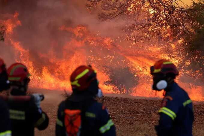 Two firefighting helicopters collide while battling wildfires near Athens
