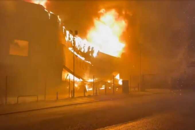 Huge blaze destroys Salford fashion store as major road closed