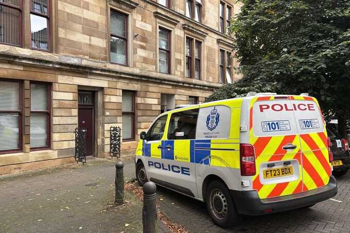 Two men found stabbed to death in Glasgow flat as police launch manhunt