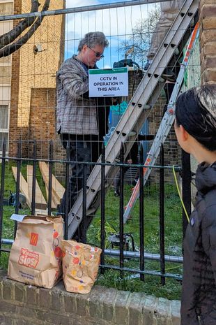 The man was pictured behind the council fence climbing a ladder at the site of the recently vandalised mural qhiquqidqtiqqkinv