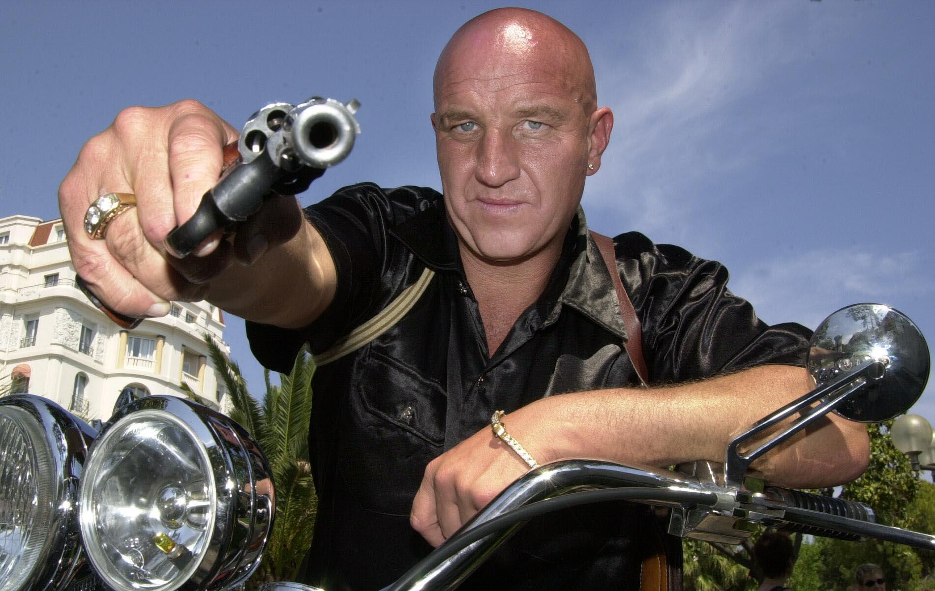 Ex-gangster pal Dave Courtney poses with a handgun