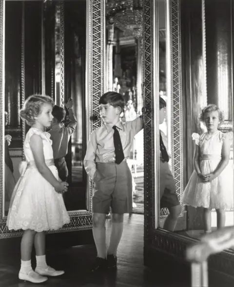 Lord Snowdon Princess Anne and King Charles as young children, standing beside a mirror in Buckingham Palace eiqrtiqkdidtrinv