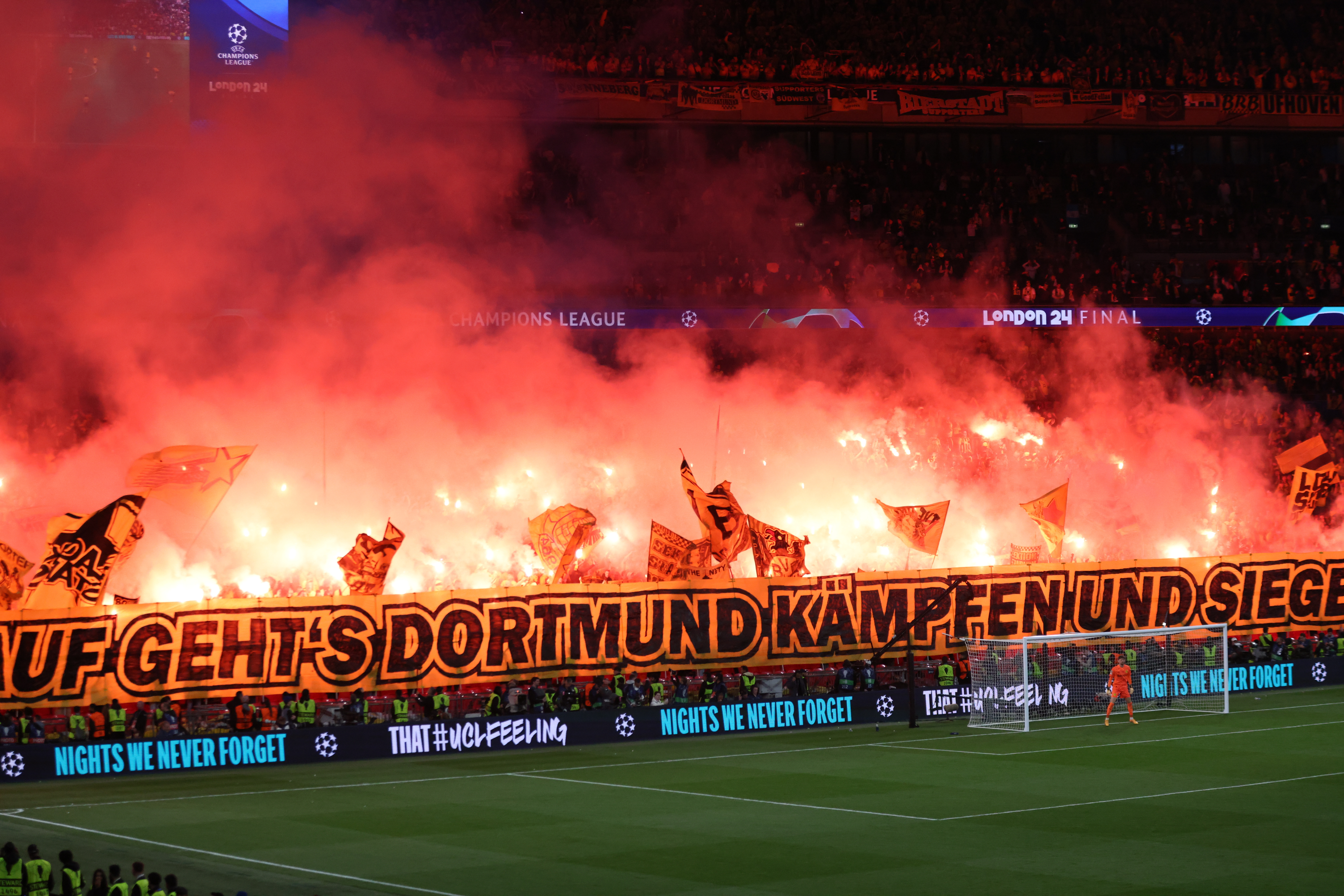 Supporters of Dortmund light flares as they perform a tifo during the UEFA Champions League final