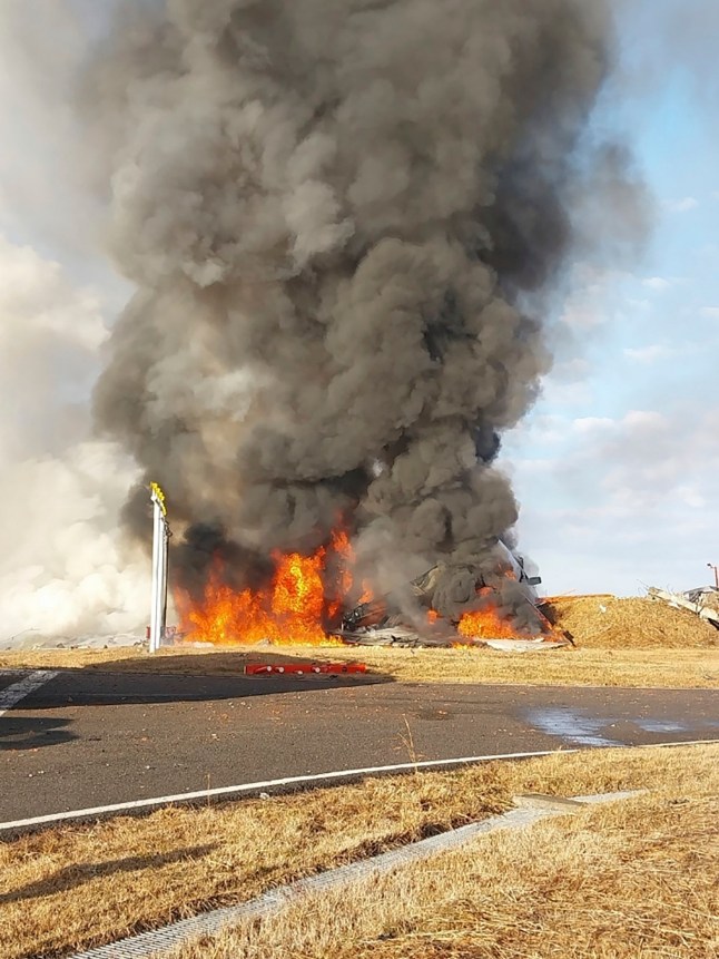 In this photo provided by South Korea’s Muan Fire Station, a passenger plane is in flames at the Muan International Airport in Muan, South Korea, Sunday, Dec. 29, 2024. (South Korea’s Muan Fire Station via AP) qeithiqqziqhdinv