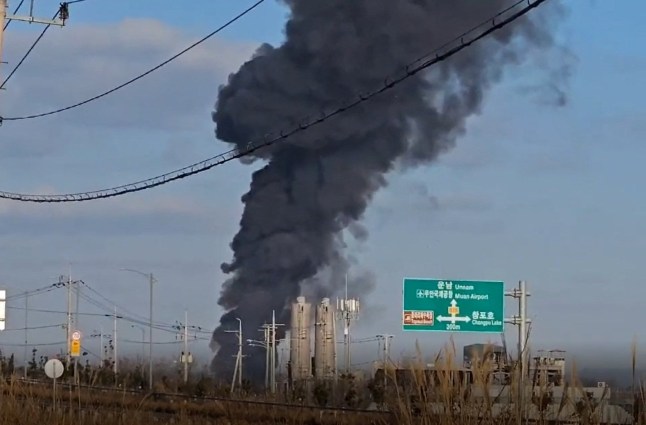 This screen grab from video footage captured near Muan International Airport shows black smoke billowing into the air from the airport in Muan, South Jeolla Province, South Korea, December 29, 2024. Yonhap via REUTERS THIS IMAGE HAS BEEN SUPPLIED BY A THIRD PARTY. NO RESALES. NO ARCHIVES. SOUTH KOREA OUT. NO COMMERCIAL OR EDITORIAL SALES IN SOUTH KOREA.