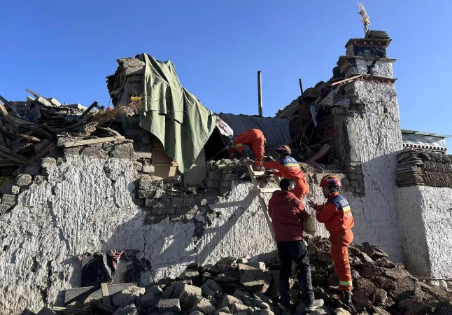 In this photo released by Xinhua News Agency, rescue workers search for survivors in the aftermath of an earthquake in Changsuo Township of Dingri in Xigaze, southwestern China’s Tibet Autonomous Region on Tuesday, Jan. 7, 2025. (Xinhua via AP)