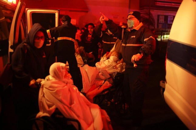 Residents of a senior center are evacuated as the Eaton Fire approaches Tuesday, Jan. 7, 2025 in Altadena, Calif. (AP Photo/Ethan Swope)