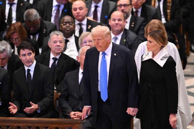 US President-elect Donald Trump and former First Lady Melania Trump arrive to attend the State Funeral Service for former US President Jimmy Carter at the Washington National Cathedral in Washington, DC, on January 9, 2025. (Photo by Mandel NGAN / AFP) (Photo by MANDEL NGAN/AFP via Getty Images)