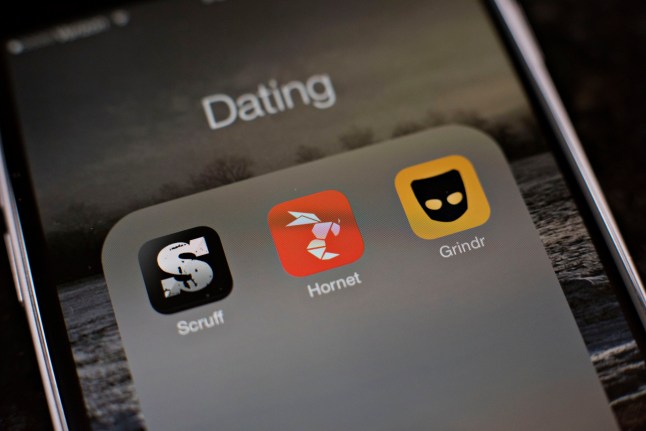 Gay dating apps Scruff, Hornet, and Grindr are displayed for a photograph on an Apple Inc. iPhone in Tiskilwa, Illinois, U.S., on Tuesday, Jan. 20, 2015. For gay men flocking to smartphone dating applications, making a connection increasingly comes with messages about HIV status, testing and drug regimens. Some apps let users declare their status, remind them to get tested and give locations of the closest clinics. Photographer: Daniel Acker/Bloomberg via Getty Images