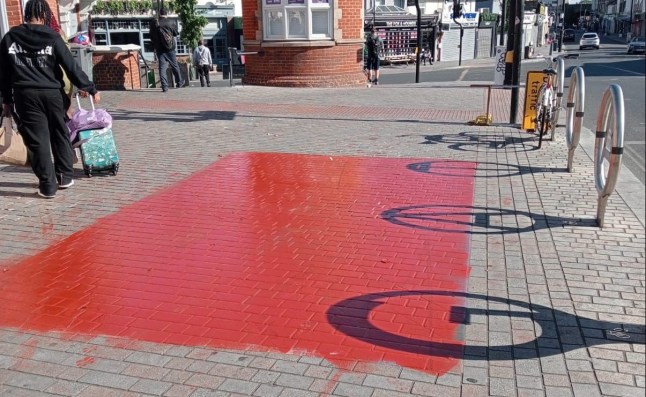 Detectives are appealing for information after a number of Pride flags were vandalised by two men in north east London. The Metropolitan Police said officers are linking the homophobic attacks in Forest Gate, Newham. Red paint was daubed over a large painted Pride flag on the pavement outside Forest Gate railway station in Woodgrange Road early on Sunday.