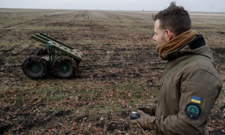 A Ukrainian serviceman operates a mine-laying unmanned ground vehicle in the Kharkiv region eiqrtireiudinv