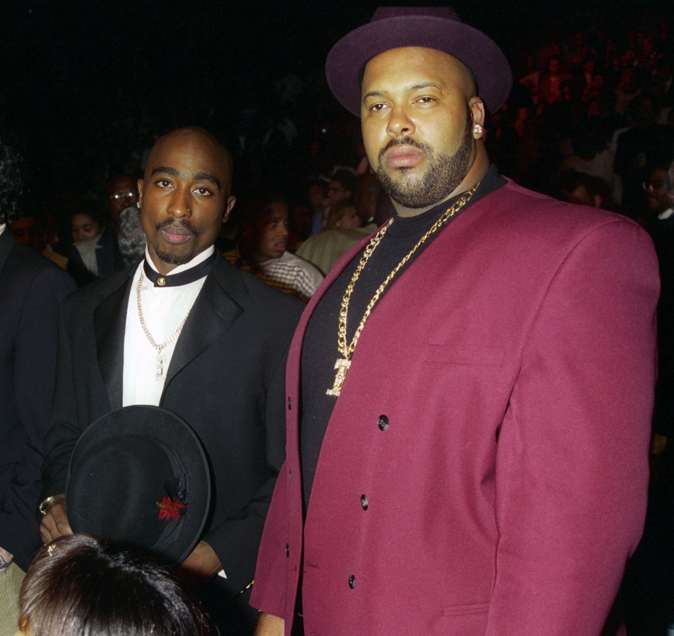 Tupac Shakur and Suge Knight at an event. qhiqqhiqxriqzzprw