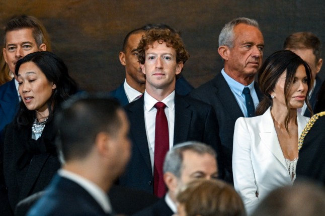 CEO of Meta, Mark Zuckerberg (C) attends the inauguration ceremony where Donald Trump will sworn in as the 47th US President in the US Capitol Rotunda in Washington, DC, on January 20, 2025. (Photo by Kenny HOLSTON / POOL / AFP) (Photo by KENNY HOLSTON/POOL/AFP via Getty Images)