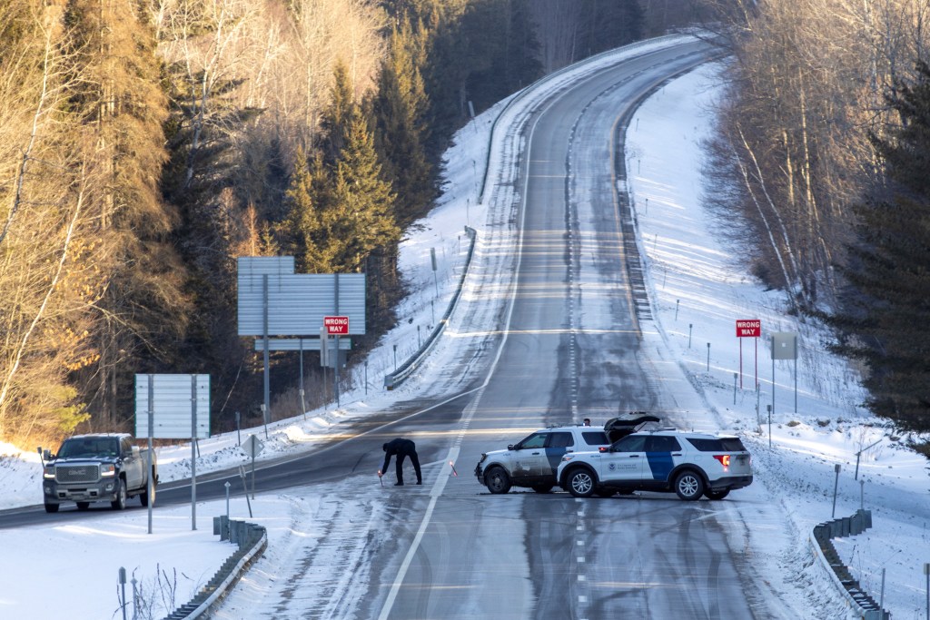 U.S. Border Patrol officer deploying a flare while blocking Interstate 91 southbound in Coventry, Vermont following the shooting of a fellow officer