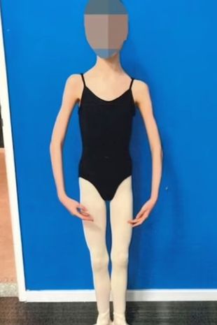 The girl pictured in a black leotard