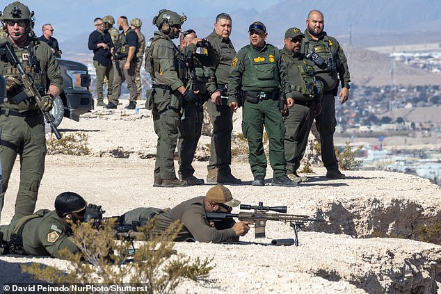 US law enforcement agents stationed at the US-Mexico border were warned this week about possible attacks from Mexican drug cartels using kamikaze drones with explosives (Pictured: Various officers monitor at the El Paso border crossing in Texas on February 3) eiqeeiqekieeinv