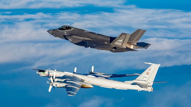 In this March 2020 handout image from the Norwegian Armed Forces a Norwegian F-35 fighter jet intercepts a Russian Tupolev TU-142 (Bear-J)near Norwegian air space along the Norwegian / Russian border. The "Bear-J" aircraft is being used as a communications relay and control center for Russian submarines according to the Norwegian Armed Forces. (Photo by Handout / Forsvaret / AFP) / RESTRICTED TO EDITORIAL USE - MANDATORY CREDIT "AFP PHOTO / FORSVARET " - NO MARKETING NO ADVERTISING CAMPAIGNS - DISTRIBUTED AS A SERVICE TO CLIENTS (Photo by HANDOUT/Forsvaret/AFP via Getty Images) qhiqhhidrdiqkkinv