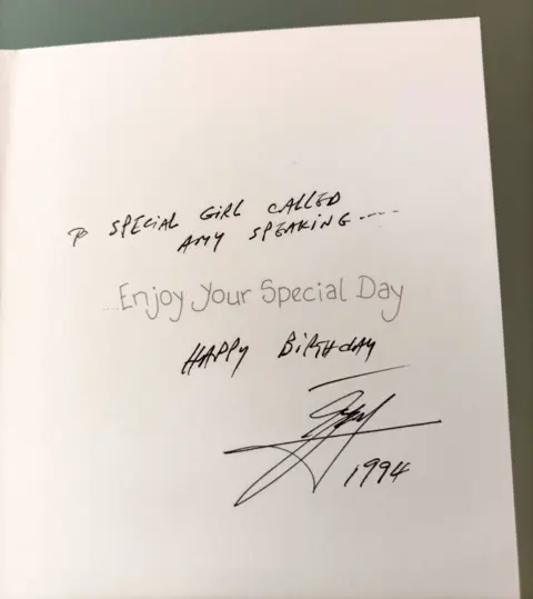 A close-up photo of the inside of a birthday card Amy says Ali sent her. ’To a special girl called Amy Speaking’ is written in the card as well as ’happy birthday’ and a signature with ’1994’ beneath 