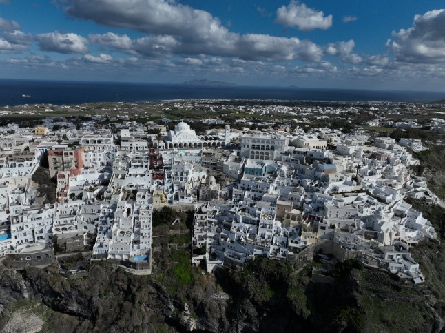 A drone view shows the village of Fira, as the increased seismic activity continues on the island of Santorini, Greece, February 7, 2025. REUTERS/Stelios Misinas eidqiqeriqdrinv