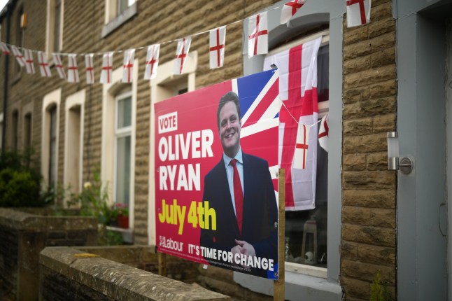 BURNLEY, ENGLAND - JUNE 25: An election placard for Labour candidate Oliver Ryan stands outside a home on June 25, 2024 in Burnley, England. When Burnley elected a Conservative MP in 2019, it was the first time in more than a century. Ahead of the general election on July 4th, electoral forecasts are predicting a Labour win, which would allow the party to replace another brick in its "red wall" of traditionally Labour-aligned constituencies across the Midlands and Northern England. (Photo by Christopher Furlong/Getty Images) eiqduidtziqtinv