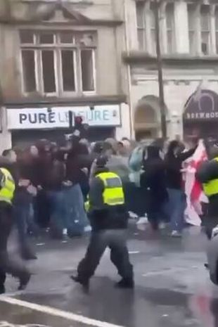 a mob walking through cardiff qhxidiqxkiqteinv