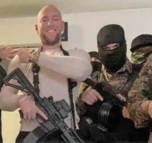 Ebben pictured with masked armed men