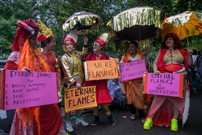 epa10708869 Drag artists meet at Tompkins Square Park before taking part in the New York City Drag March in New York, New York, USA, 23 June 2023. The annual protest and visibility march commemorates the Stonewall riots and was organized in 1994 after the NYC Pride March excluded drag queens and others from the official events. EPA/SARAH YENESEL