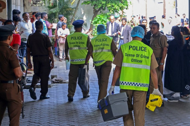 Policemen arrive at the chief magistrate’s court in Colombo on February 19, 2025. A Sri Lankan man accused of being a top drug dealer was shot dead inside a courthouse on February 19 by a gunman disguised as a lawyer, police said. Ganemulle Sanjeeva was shot at close range as he entered the dock in a bail hearing at the Colombo Magistrates Court, police said in a statement. (Photo by AFP) (Photo by -/AFP via Getty Images) tdiqriqdriqtrinv