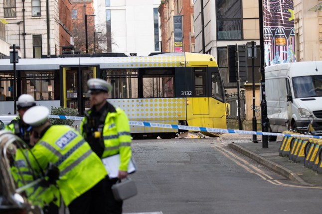 Manchester tram crash scene with police tape. qhiqhhiqeziqquinv