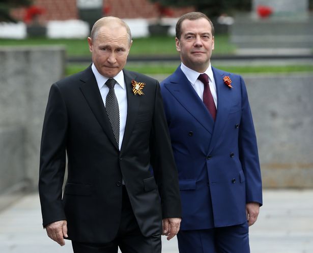 Dmitry Medvedev, pictured with Putin, could not contain his delight at Trump’s behaviour