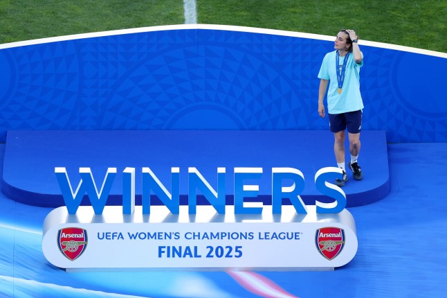 LISBON, PORTUGAL - MAY 24: Renee Slegers, Manager of Arsenal, looks on as she walks onto the Winners Stage after collecting her winners medal after defeating FC Barcelona during the UEFA Women&rsquo;s Champions League final match between Arsenal WFC and FC Barcelona at Estadio Jose Alvalade on May 24, 2025 in Lisbon, Portugal. (Photo by Molly Darlington - UEFA/UEFA via Getty Images)