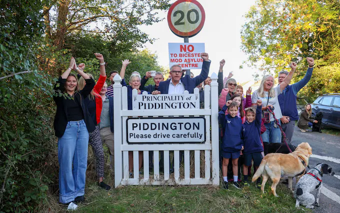 Residents with their ’Principality of Piddington’ sign